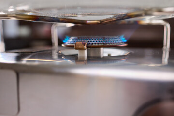 A closeup view showcasing a stylish gas stove adorned with unique and captivating flame patterns