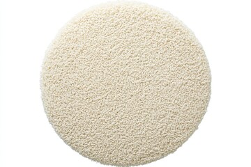 Top view of a soft round shaggy rug in cream color with a textured surface and a cozy inviting feel for home decor and interior design