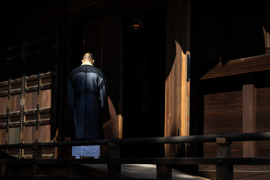 Japan, Kyoto Prefecture, Kyoto, Monk entering Buddhist temple