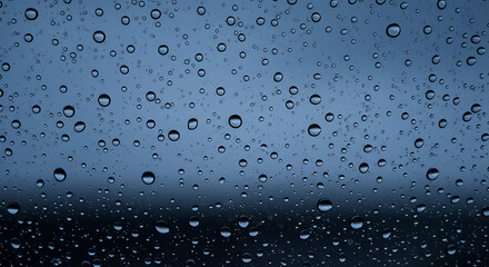 Rain droplets on glass creating a calming atmosphere  