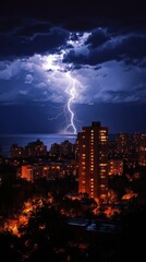 Obraz premium Dramatic lightning illuminates the night sky over a coastal city with glowing buildings and a dark ocean creating a powerful and captivating scene