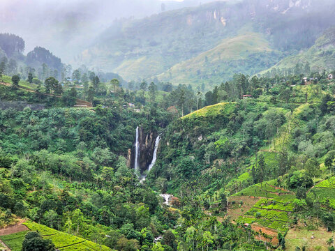 View from above of the misty mountains and Mantenga Waterfalls in Elulwini valley, Swaziland, Southern Africa