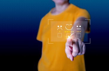 Close up woman hand show the smile face emoticon on the virtual touch screen ,give five star symbol, Customer service and business satisfaction survey.