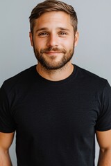 Fototapeta premium Handsome Caucasian Male Portrait Smiling Man in Black T Shirt Studio Shot