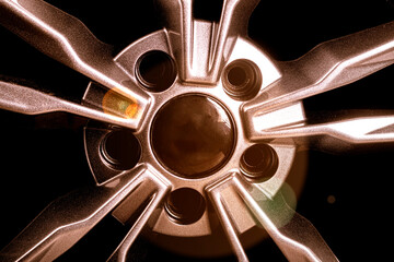 wheel. black background. car wheel with tire. disk is smelted from titanium. close-up. there is...