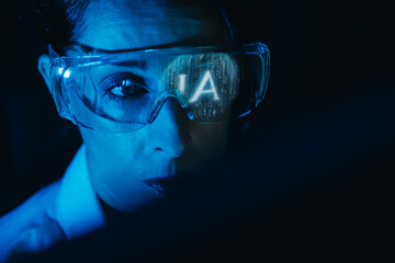 AI specialist observing artificial intelligence reflection in glasses with a neutral expression