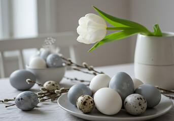 A peaceful Easter scene featuring naturally dyed eggs, delicate willows, and a single white tulip.
