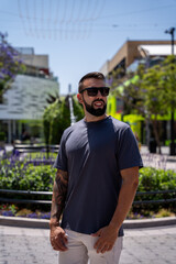 Young male tourist strolling down a street in Los Angeles, California.