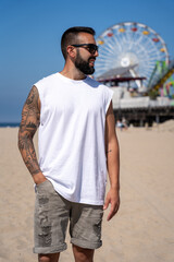 Attractive young man sightseeing at Santa Monica beach in California