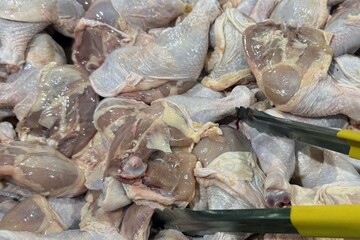 Fresh raw chicken legs for cooking in the market.