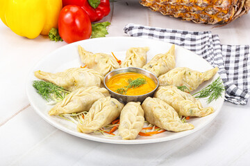 Steamed asian dumpling momo with meat