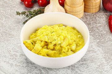 Italian cuisine - yellow risotto with chicken