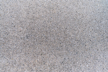 Close-up view of a smooth gray concrete surface showcasing its subtle texture and uniform color ideal for design.