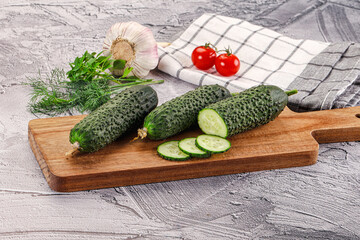 Raw green cucumbers with slices