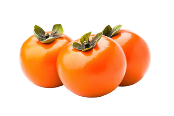 Three ripe persimmons with leaves on black background, cut out