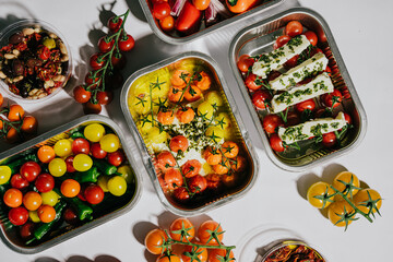 A variety of fruits and vegetables are displayed in different containers. Concept of abundance and freshness, as the colorful fruits and vegetables are arranged in a visually appealing manner