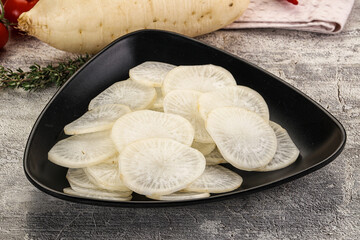 Sliced white daikon radish in the bowl