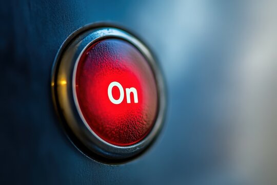 A red illuminated round power button is showing the on status - Powered by Adobe