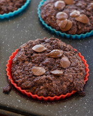 chocolate banana muffins on light background