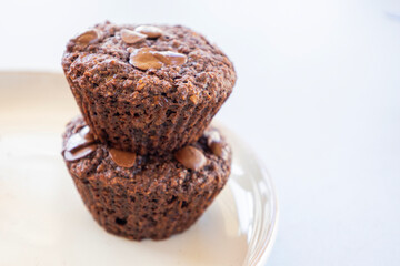  chocolate banana muffins on light background