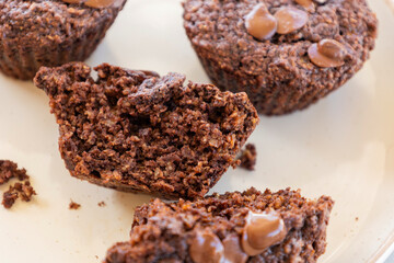  chocolate banana muffins on light background