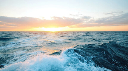 Fototapeta premium Sunset over ocean waves under a colorful sky with dramatic clouds