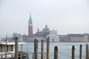 Fototapeta premium Church of San Giorgio Maggiore - La Сhiesa di San Giorgio Maggiore - on the island in Venice, view from the water. Historical landscape of Venice, atmosphere of travel.
