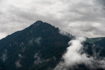 cloudy  mountain landscape inside Val di Fassa, Dolomites, Italy