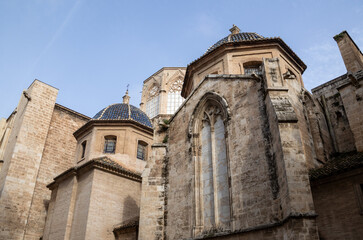 Valencia Cathedral and Miguelete Tower (Micalet) from Plaza de la Reina, Spain. A Gothic masterpiece standing tall, framed by the lively ambiance of one of Valencia’s most iconic squares.