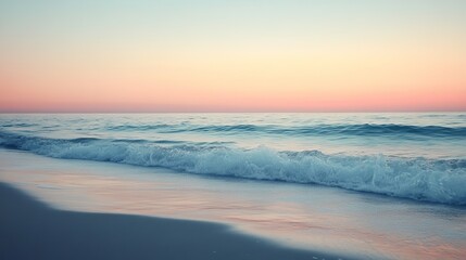 Fototapeta premium Serene Beachscape with Waves Gently Crashing on Sandy Shore under a Clear Blue Sky at Dusk