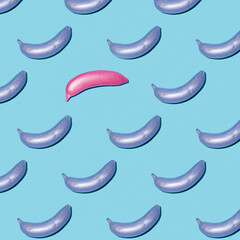 Unique arrangement of colorful bananas on a blue background showcasing creative design