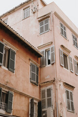 Historical Pink Building with Shuttered Windows