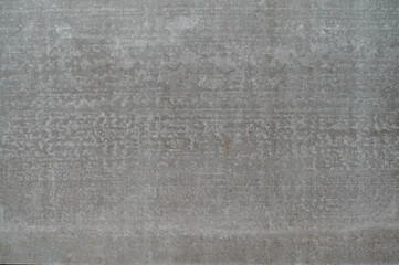 A smooth, gray surface with subtle texture creates a clean and modern background suitable for various projects.