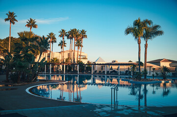 Palm trees and swimming pool at Falesia beach resort and hotels in Albufeira, Portugal