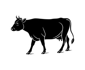 Silhouette of a cow grazing on grass