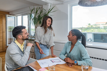 Design professional. Group of young creative freelance business people, staff meeting and developing new ideas in modern office. Discussion of workers on startup project. Successful planning