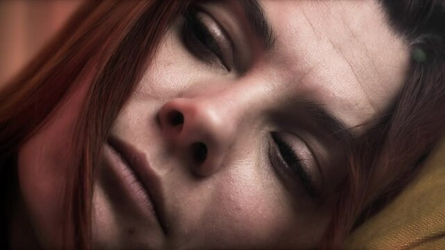 Close-up of sad woman twirling a lock of hair, focus on her face