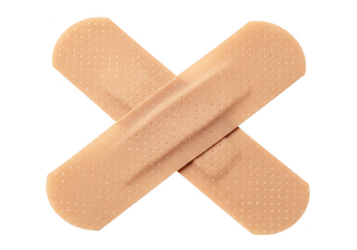 Two beige adhesive bandages arranged in an X shape isolated on transparent background