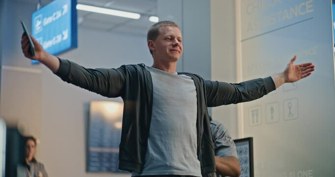 Security Checkpoint: African American TSA Officer Checking Young Man with Prosthetic Leg in Airport Terminal. Passenger Screening Procedures for Boarding Flight. Traveler with Disability Going on Trip