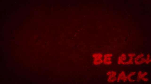 Grunge style be right back animated overlay with red glowing text