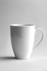 Obraz premium Elegant White Ceramic Mug on Soft Gray Background Minimalist Still Life Photography for Coffee or Tea