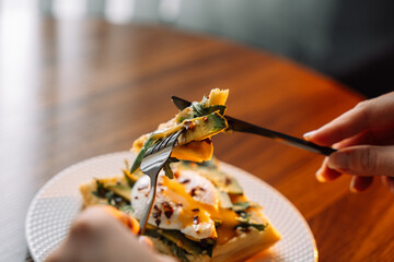 waffles with poached egg avocado on plate on wooden background