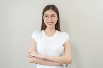 Fototapeta premium Portrait of beautiful asian young woman happy wearing glasses and smiling, cute girl with new eyeglasses sitting relaxed with copy space isolated on background. Health care of optical people concept.