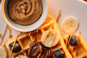 Sweet waffles with banana, Blueberry Peanut Butter, close up photo
