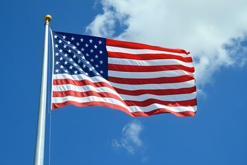A beautiful American flag is flying high in the sky