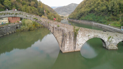 Aerial view of the iconic Devil’s Bridge in Tuscany, Italy, surrounded by scenic beauty