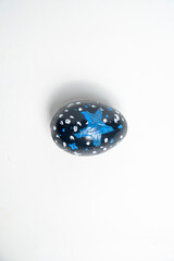 Top view of a colorful decorated easter egg. Concept of celebrating the easter holiday