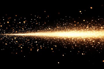 Shimmering golden particles create a dazzling effect in a dark background during a festive celebration