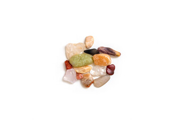Top view of small colorful stones on white background