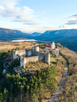 Vertical view of the Drivenik Castle, Croatia and Vinodolska dolina surrounded by high mountains